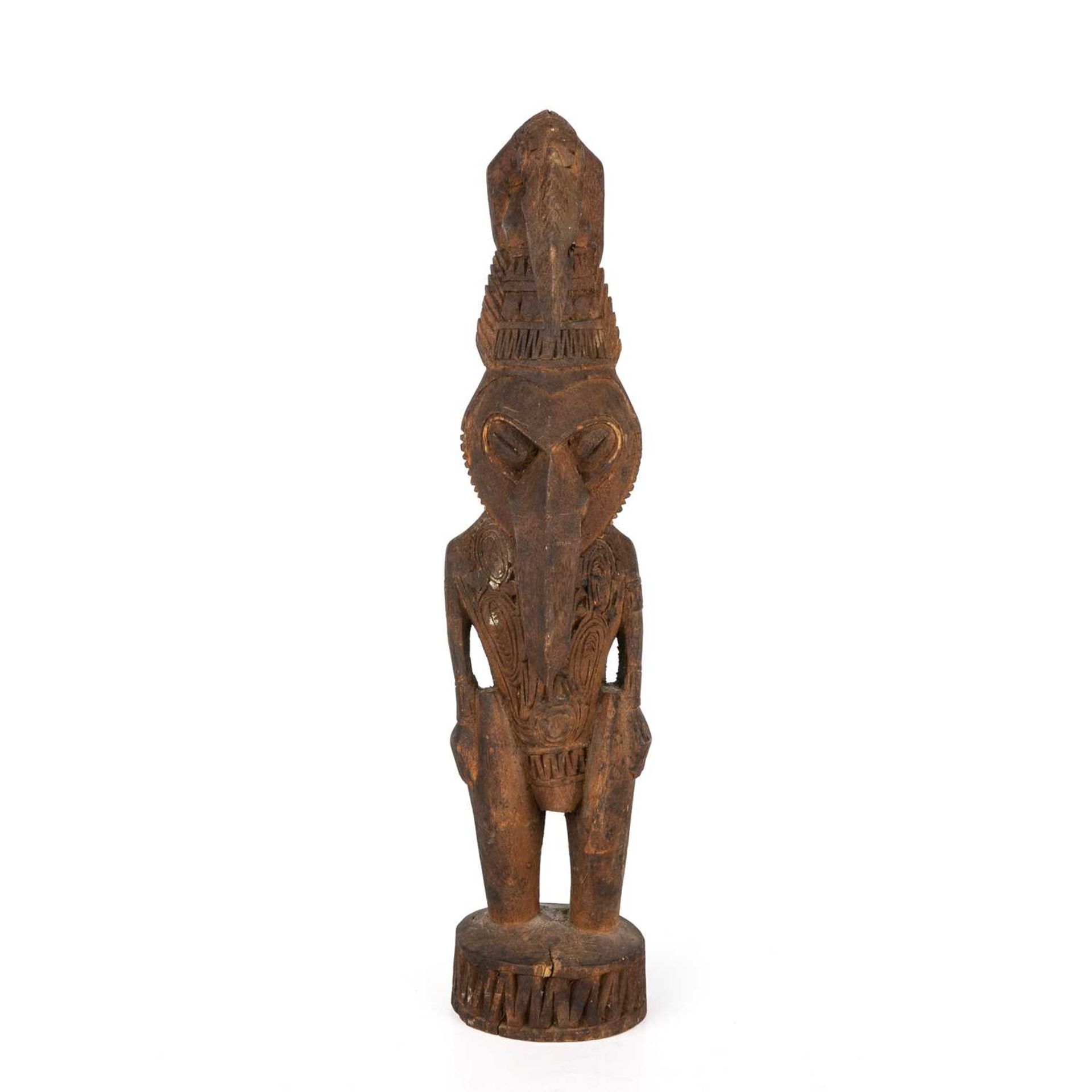 A mid to late 20th century south sea islands carved wooden figure 37cm high.