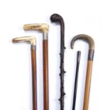 Three antique malacca walking canes with white metal collars, a hawthorn cane and a St John's