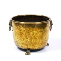 A 19th century brass log bin with lion's mask ring handles and three paw feet 49cm diameter x 37cm