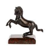 A 19th century Italian rearing Horse, bronze on a marble base 17cm wide 17cm high