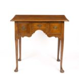 A 19th century oak low boy with three drawers and turned cabriole legs. 78cm wide 50cm deep 73cm