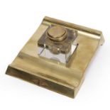 A brass and glass desk ink stand with an RAF badge. 18cm wide 21cm deep.