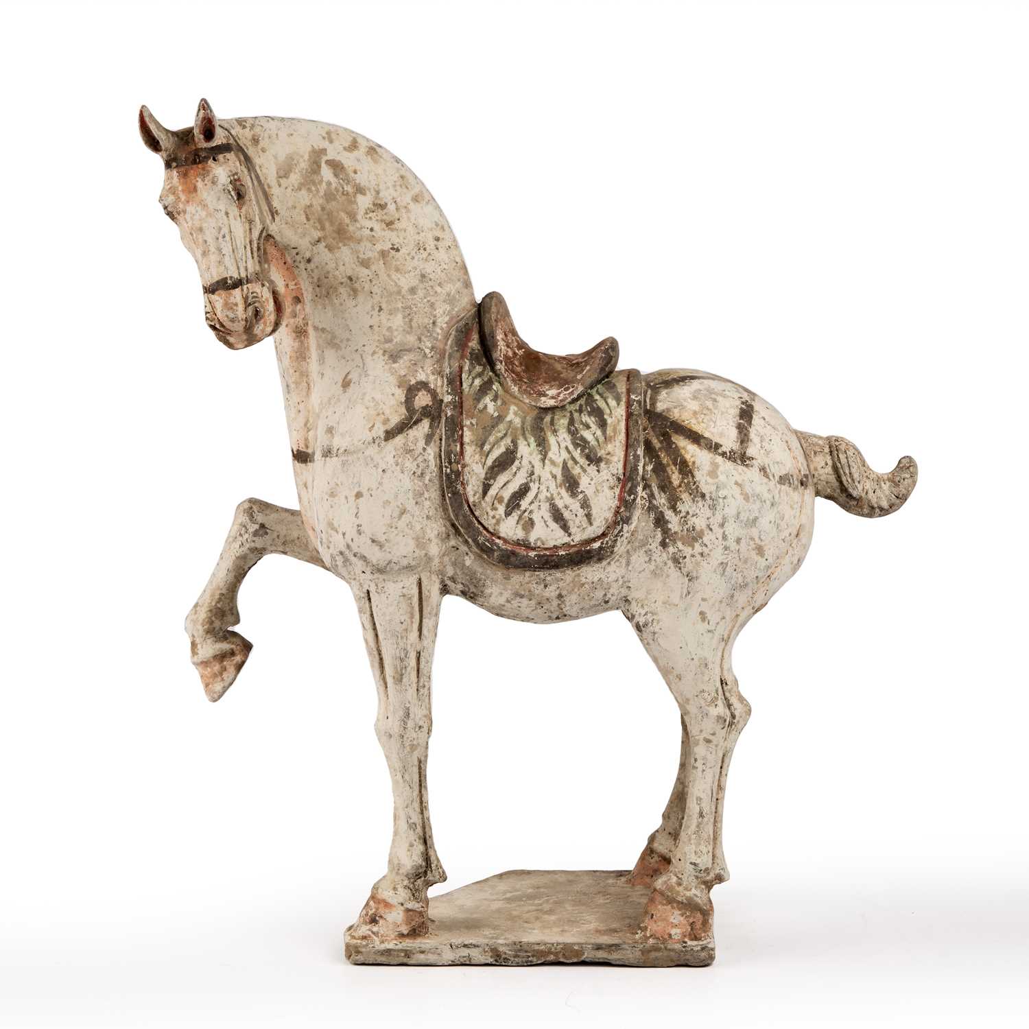 A Chinese Tang dynasty (618 - 906 AD) painted pottery prancing horse 38cm wide 42cm high. Sold