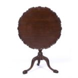 A 19th century mahogany piecrust tilt top tripod table The single piece top 75cm diameter x