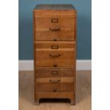 An early 20th century oak three drawer filing cabinet