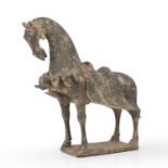 A Chinese Northern Wei (386 - 535 AD) grey pottery horse with saddle 30cm wide 32cm high sold with a