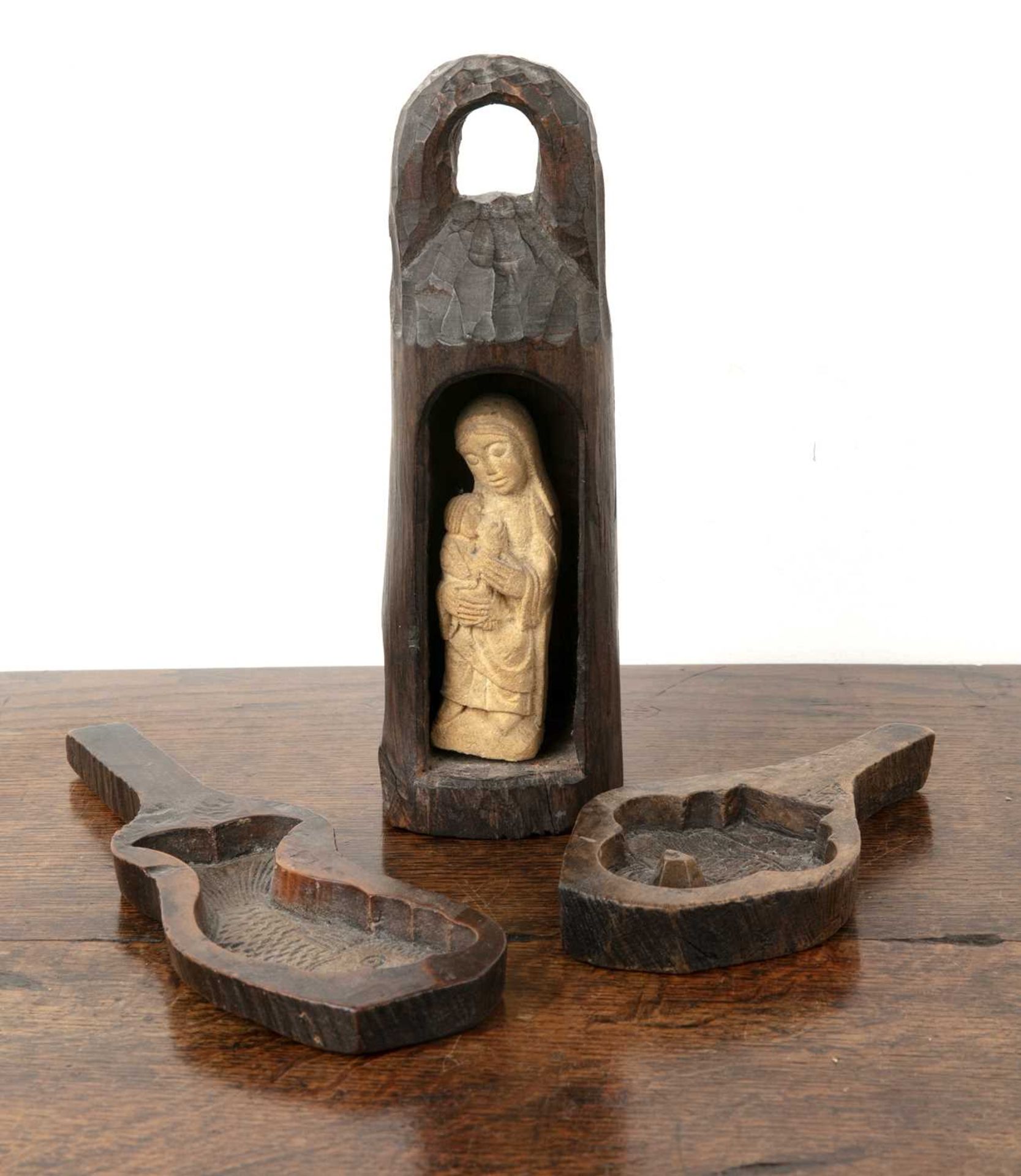 After Eric Gill (182-1940) carved stone Madonna and child in wooden carved stand, stone carving