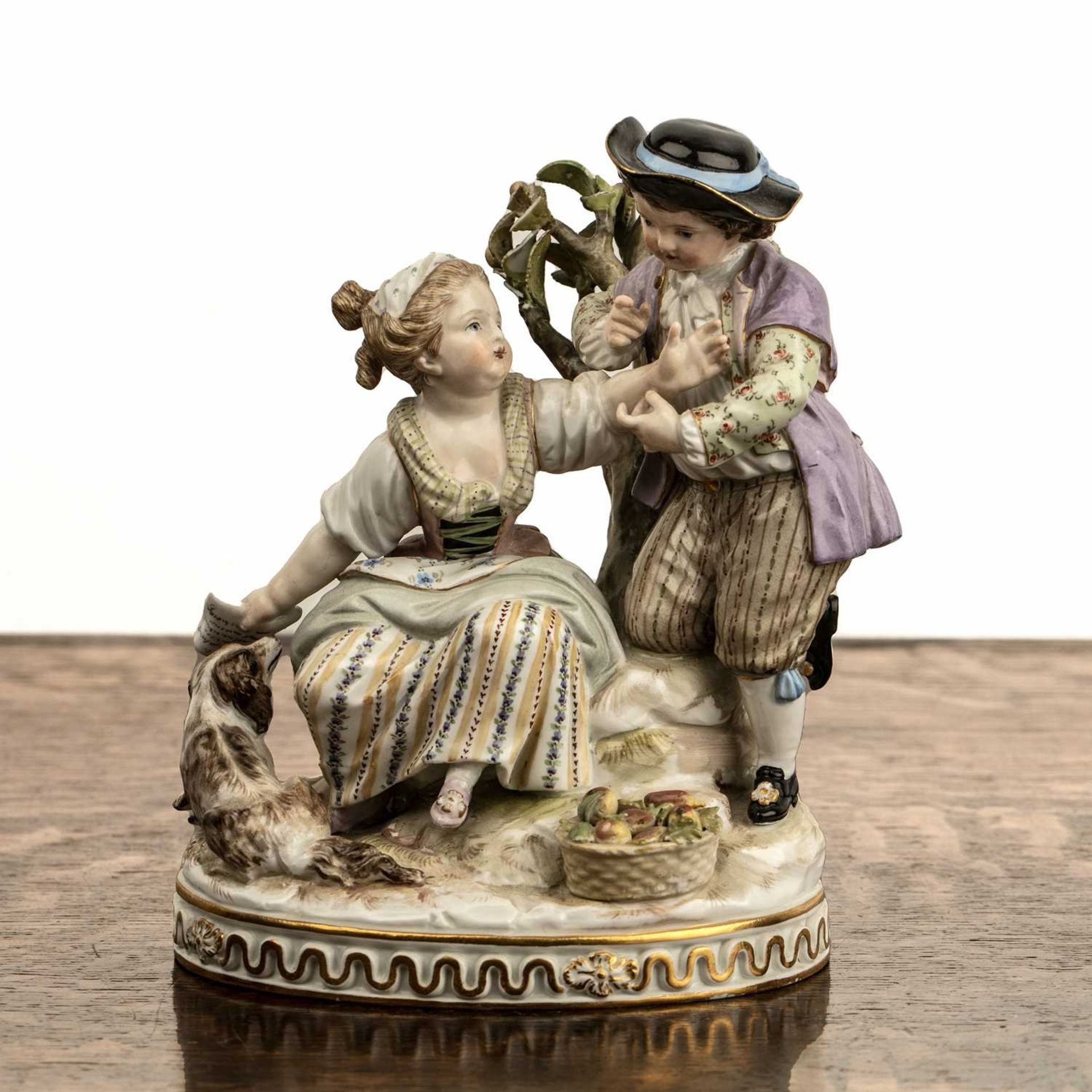 Meissen porcelain figure group of two young children, the little girl with a dog and her feet and