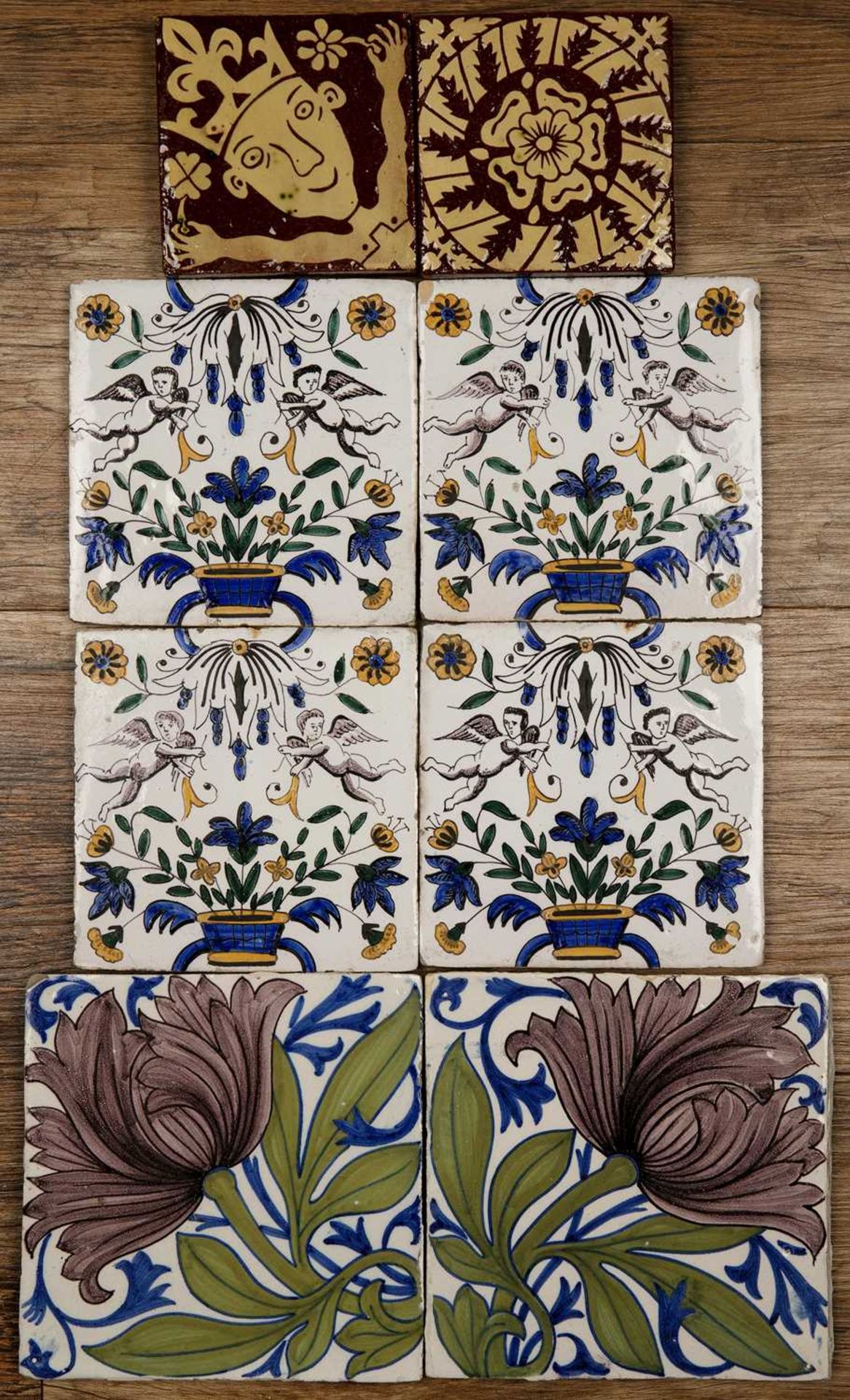 Group of tiles including two Michelle Soinne slipware tiles, 9.7cm wide, two William De Morgan style