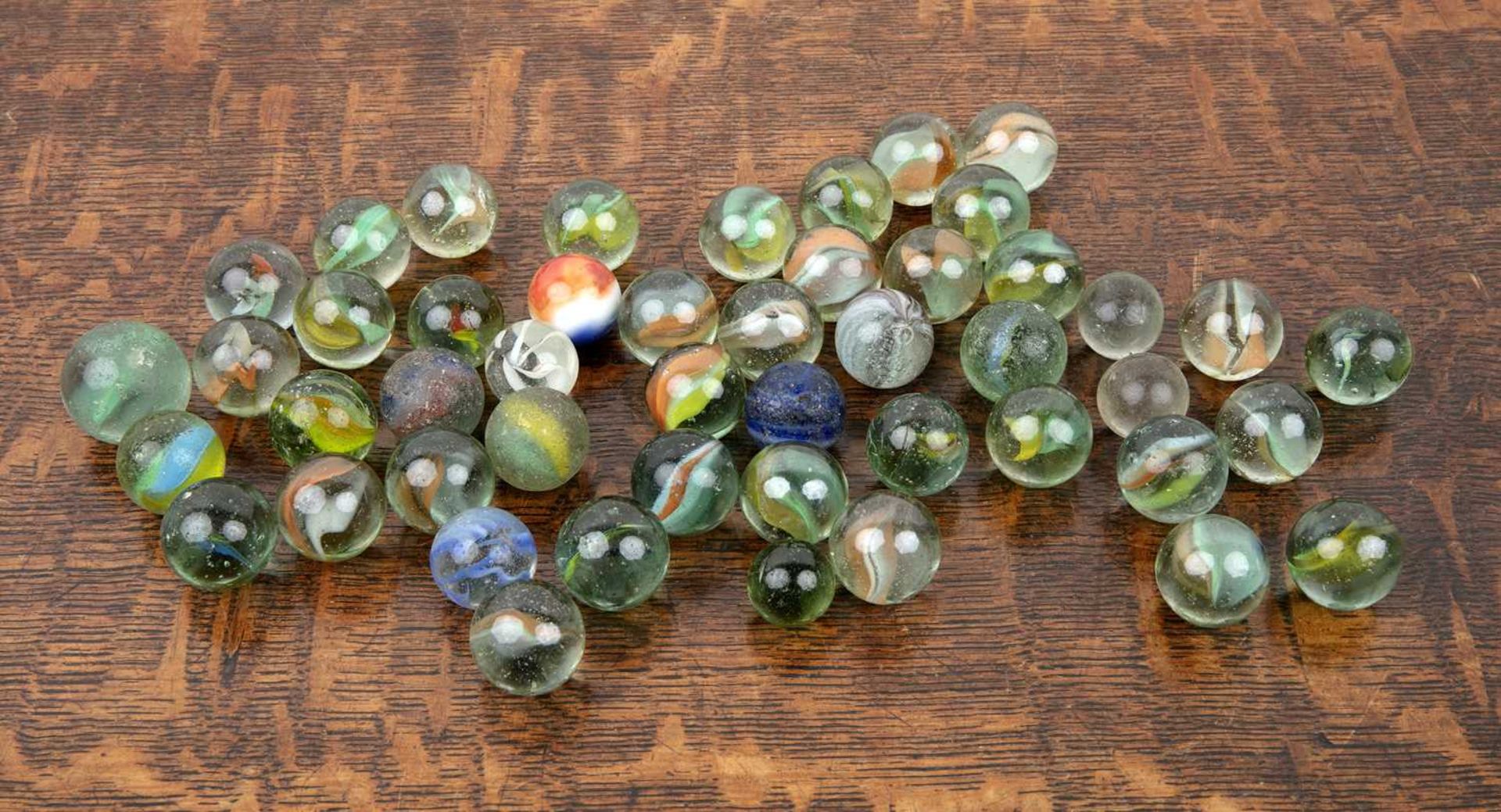 Collection of green and coloured glass marbles Provenance: The property of a Gentleman, from a