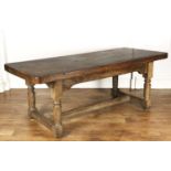 Solid elm plank top refectory table on turned supports and a central stretcher, 199cm long x 84cm