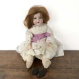 Armand Marseille childs doll painted glass eyes, wearing a broderie anglaise dress, back of the head