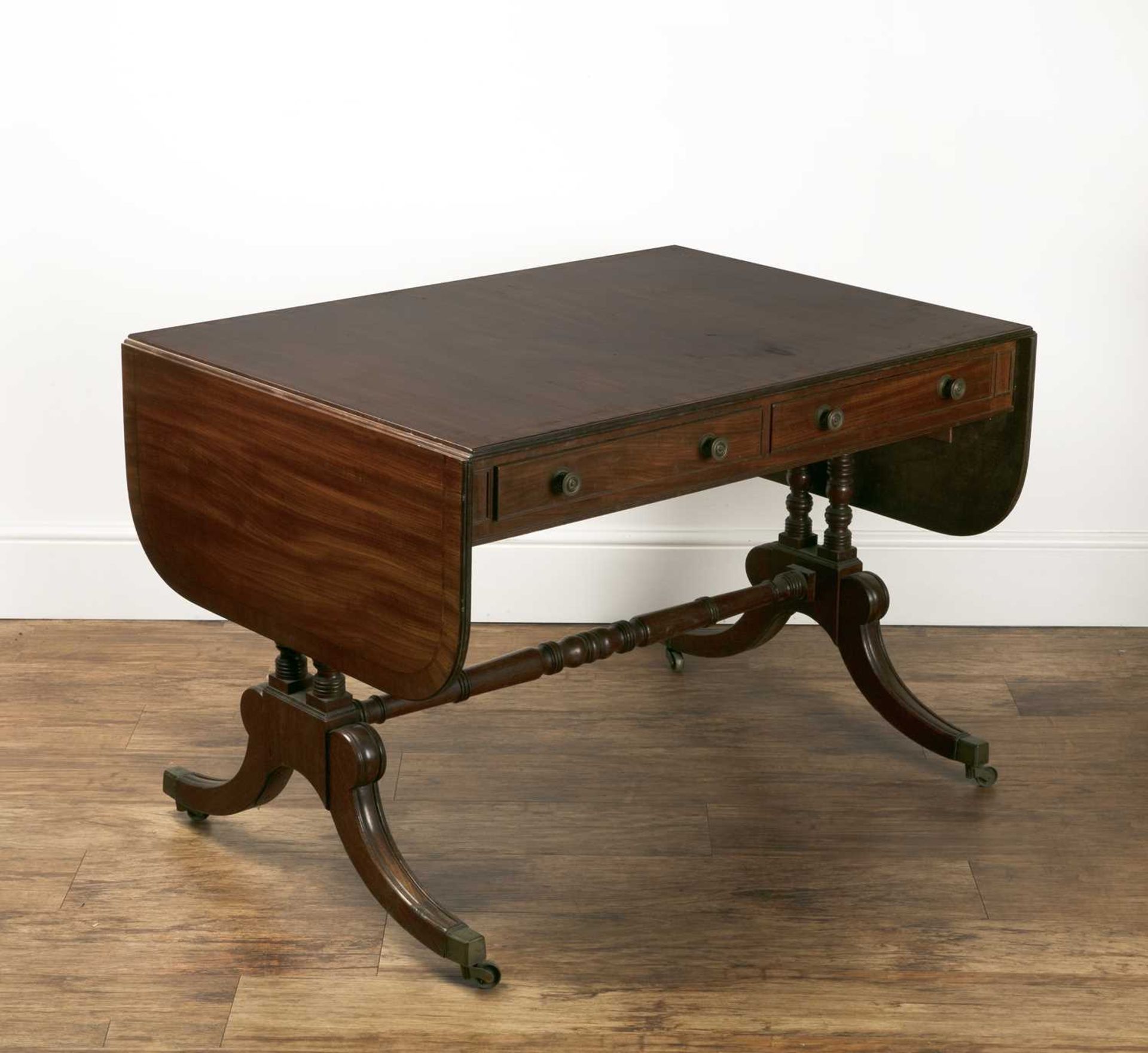 Mahogany and crossbanded sofa table 19th Century, with two fitted drawers and two dummy drawers,