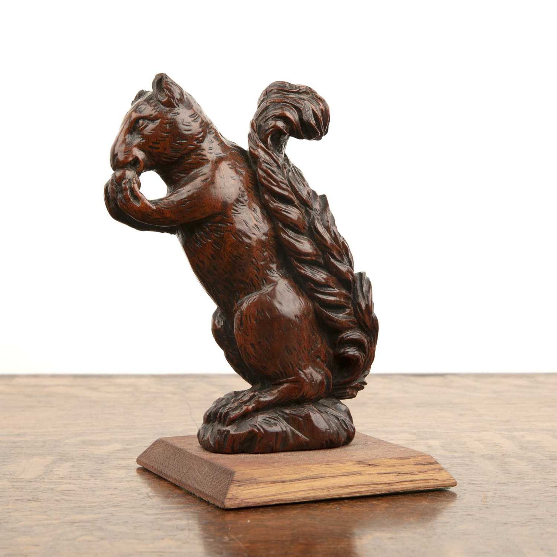 Treen model of a squirrel 19th Century, the animal crouched and about to eat a nut, on a later - Image 2 of 3