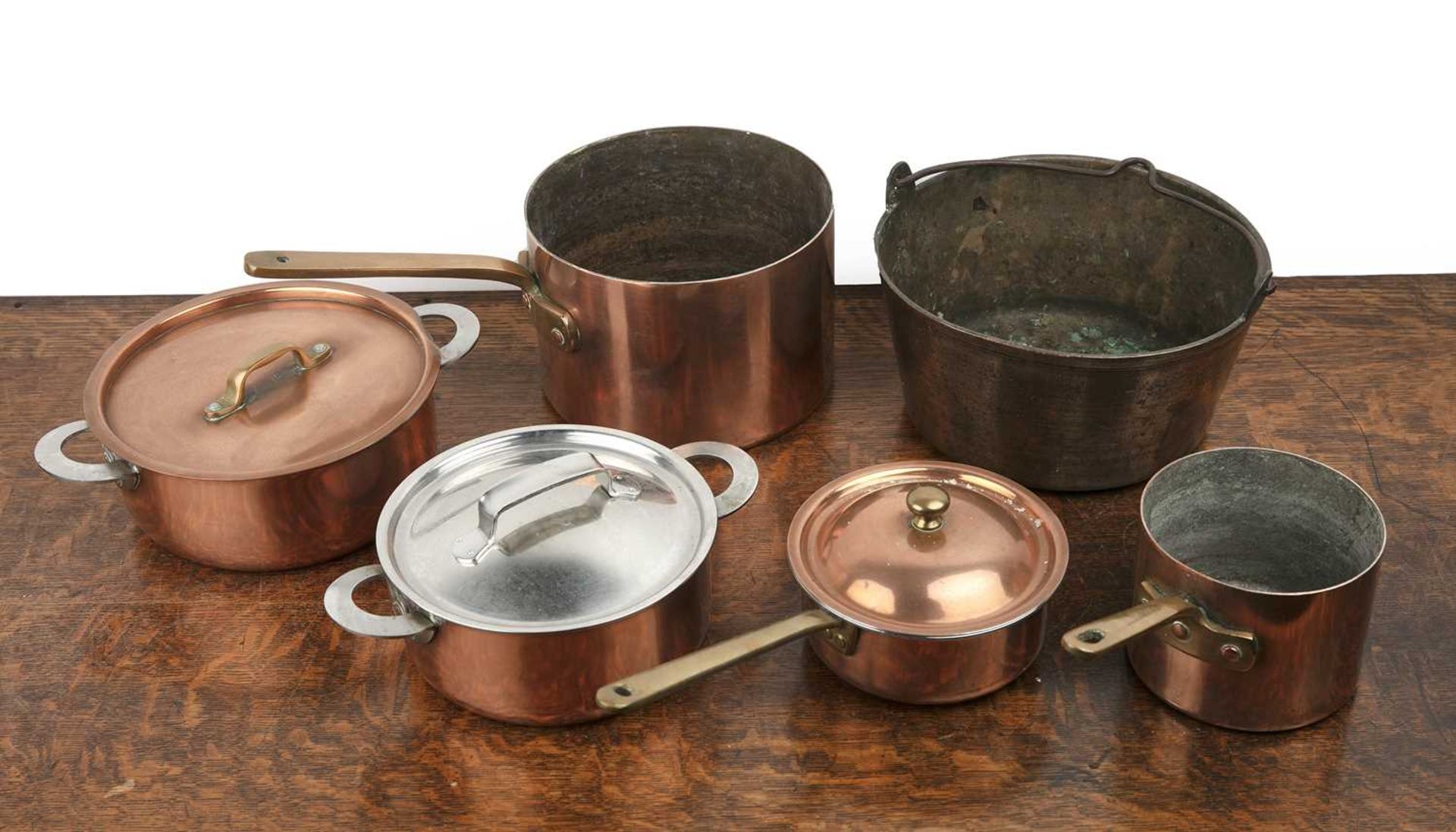 Collection of copper saucepans comprising of a brass jam pan, 26cm across, copper and steel