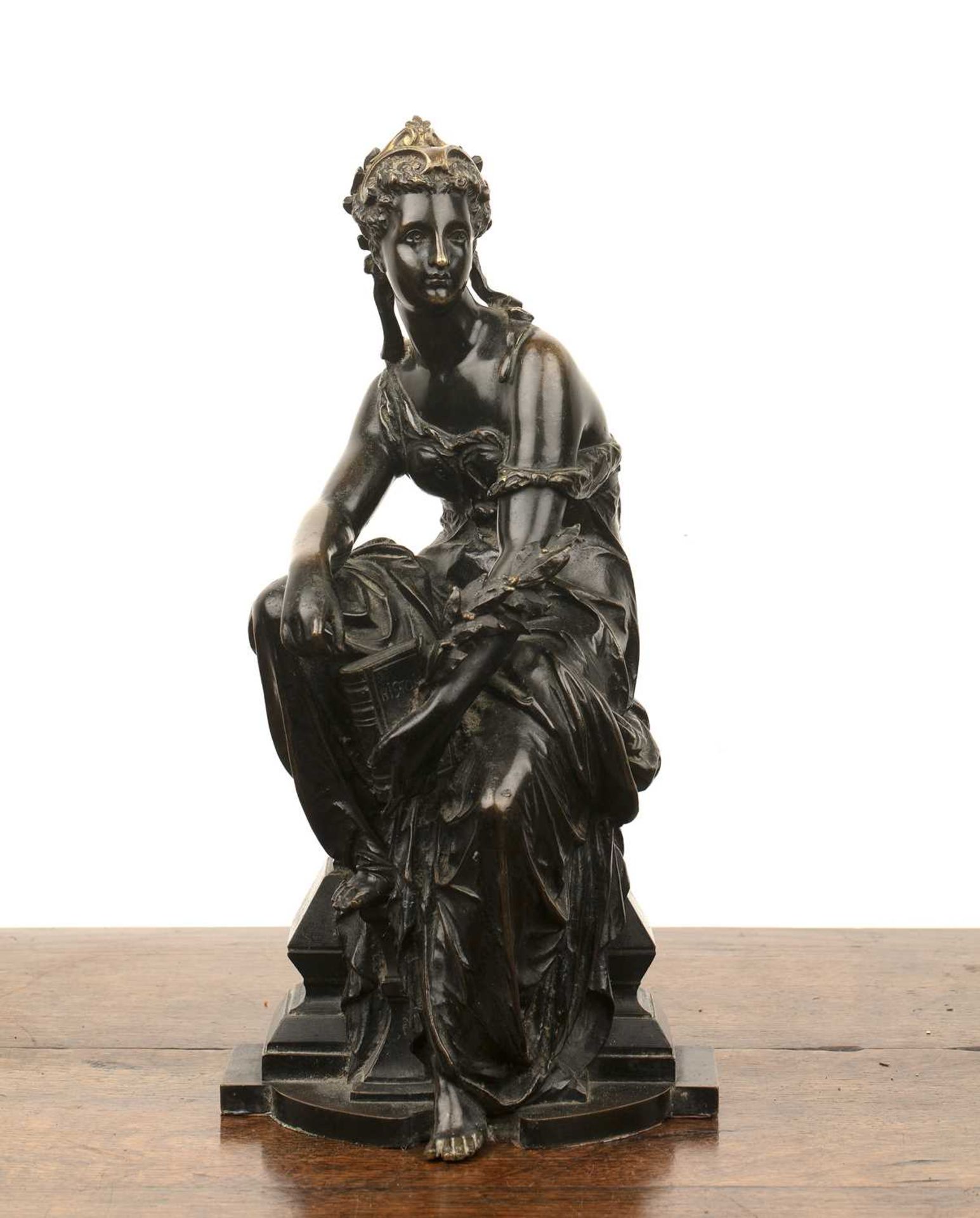Bronze model of a lady French, late 19th Century, the seated figure holding a book, 37cm highWith