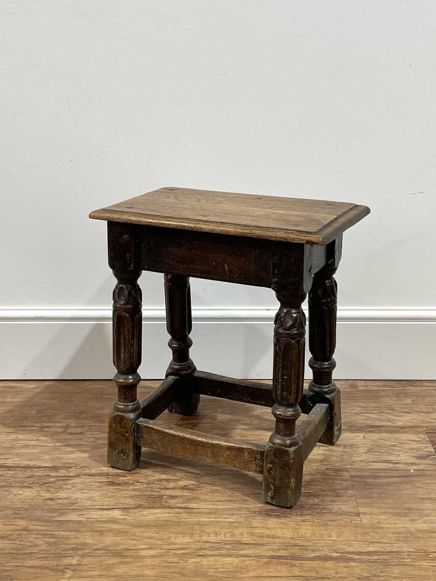 Oak joint stool 18th Century, with carved decoration, 43cm x 27.5cm x 48cm Provenance: The