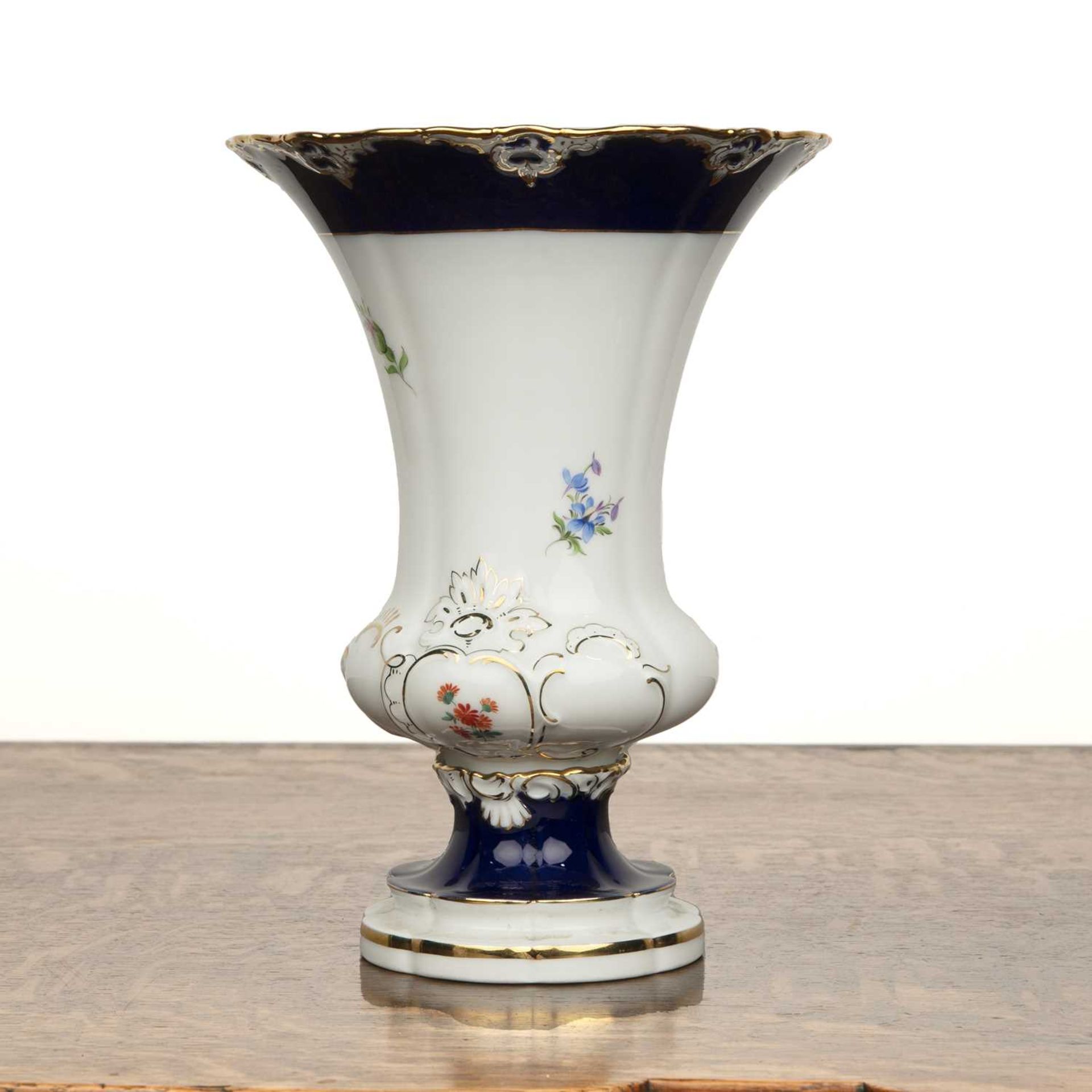 Meissen porcelain urn shaped vase with flaring rim on shaped base, decorated with flowers on a white - Image 2 of 3