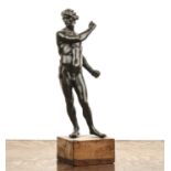 Bronzed model of a standing male figure early 20th Century, the figure with his head turned to the