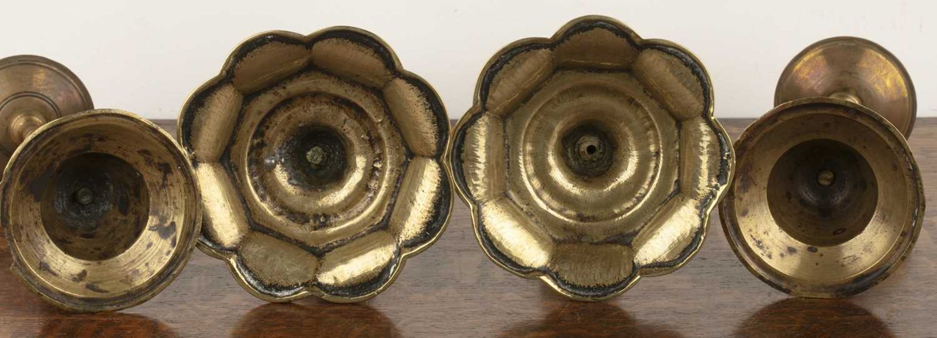 Two pairs of Continental brass candlesticks 18th Century and later, the smaller pair on shaped lotus - Image 3 of 3