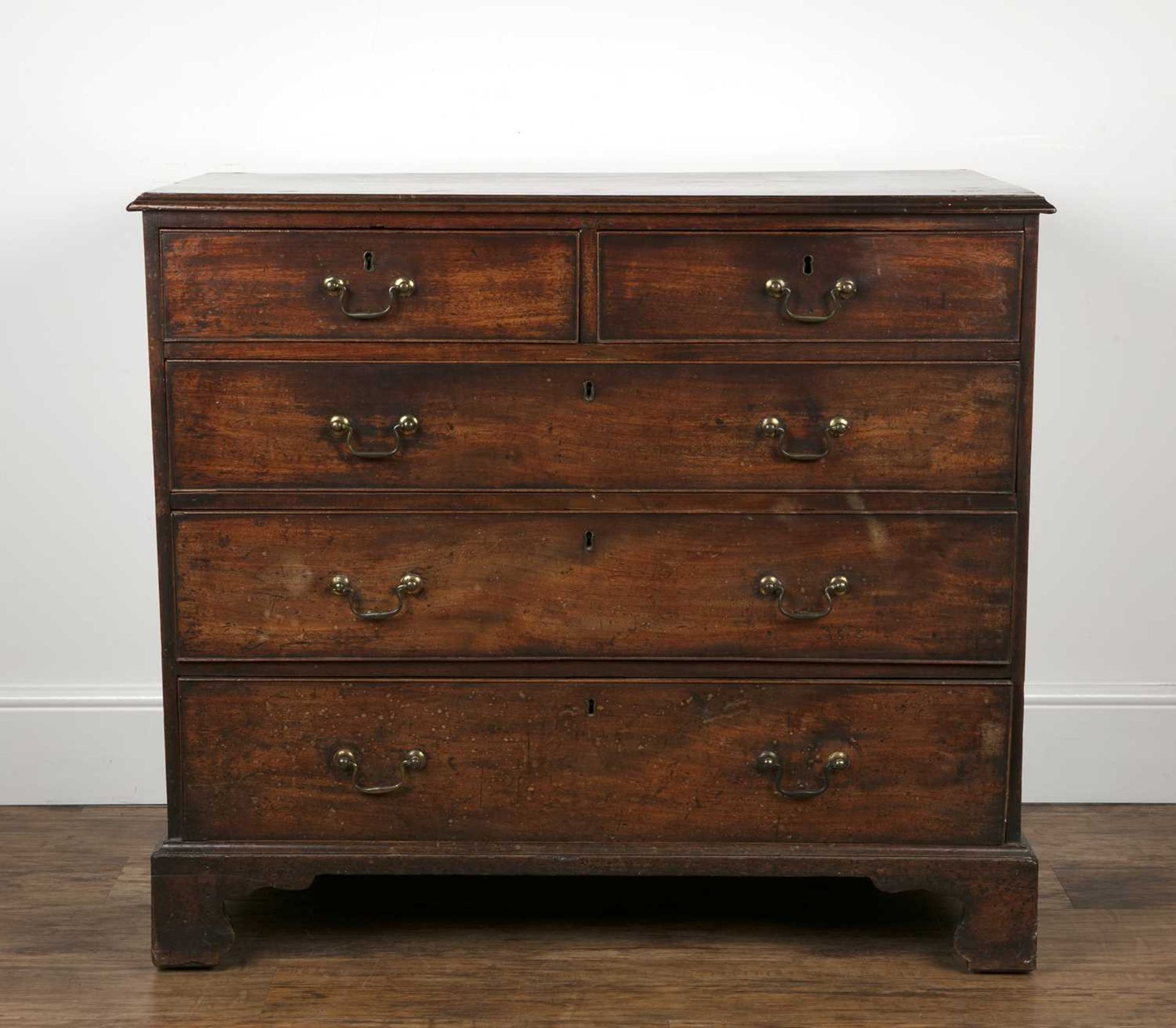 Mahogany and crossbanded straight front chest of drawers early 19th Century, with brass drop