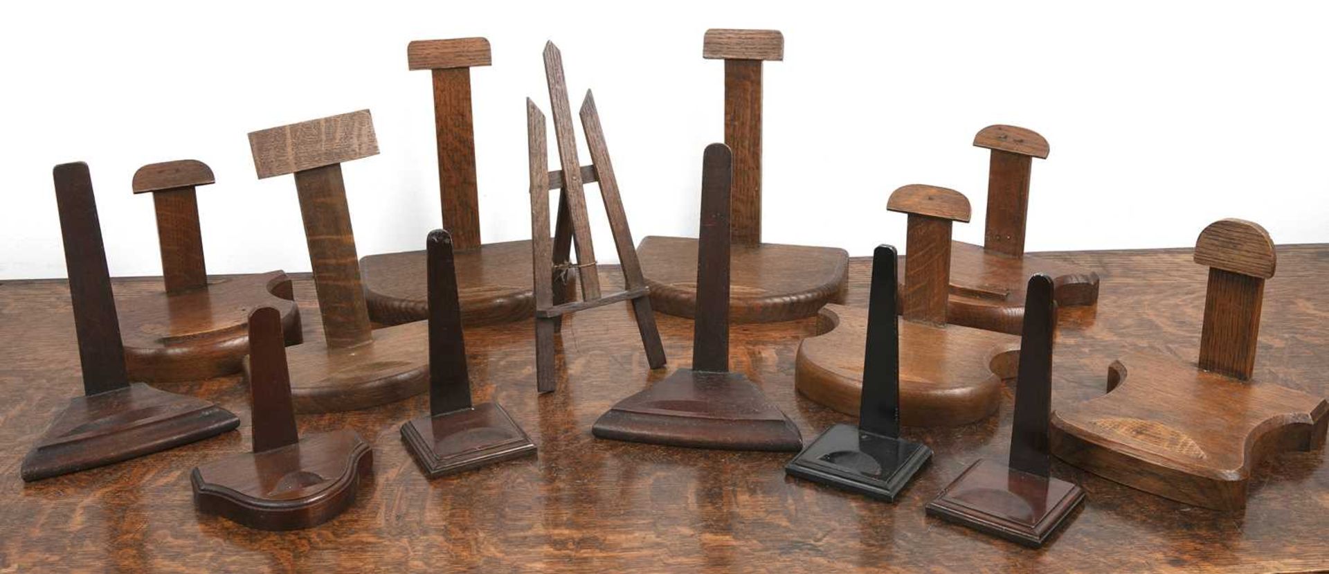 Collection of wood plate stands including an easel stand, 18cm high Provenance: The property of a