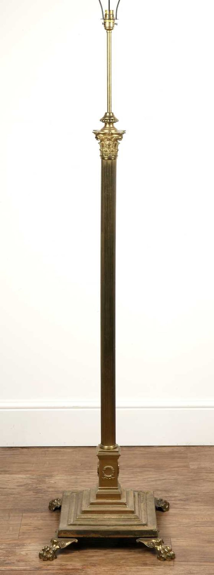 Brass Corinthian column standard lamp with a stepped base and claw feet, 153cm highWith various