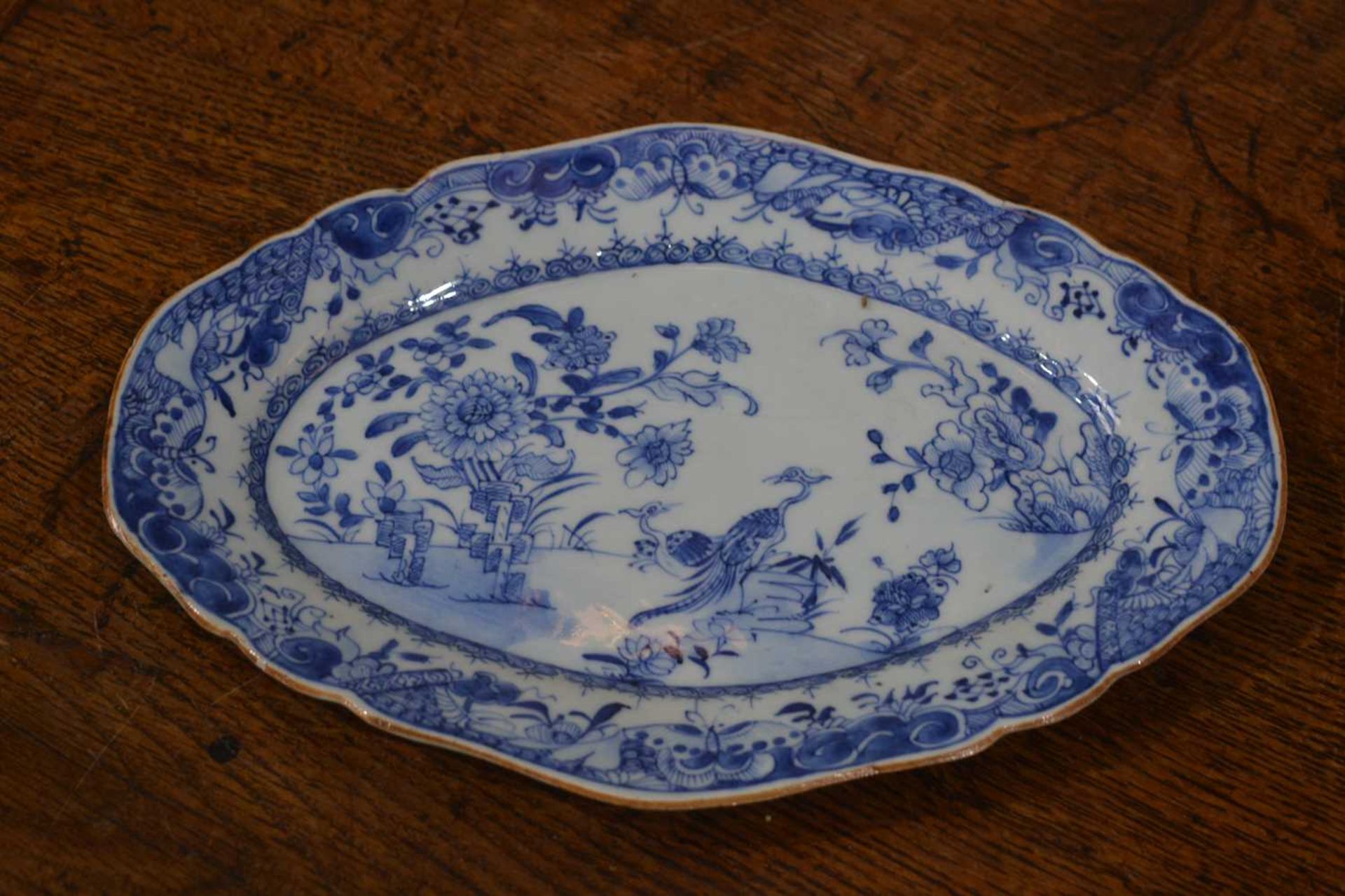 Three blue and white export dishes Chinese, circa 1800, the largest meat plate with tree and - Image 13 of 15