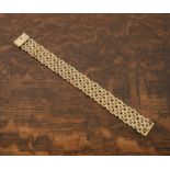 9ct gold bracelet with fancy link panels and textured slide clasp, 18.5cm overall, 23g approx