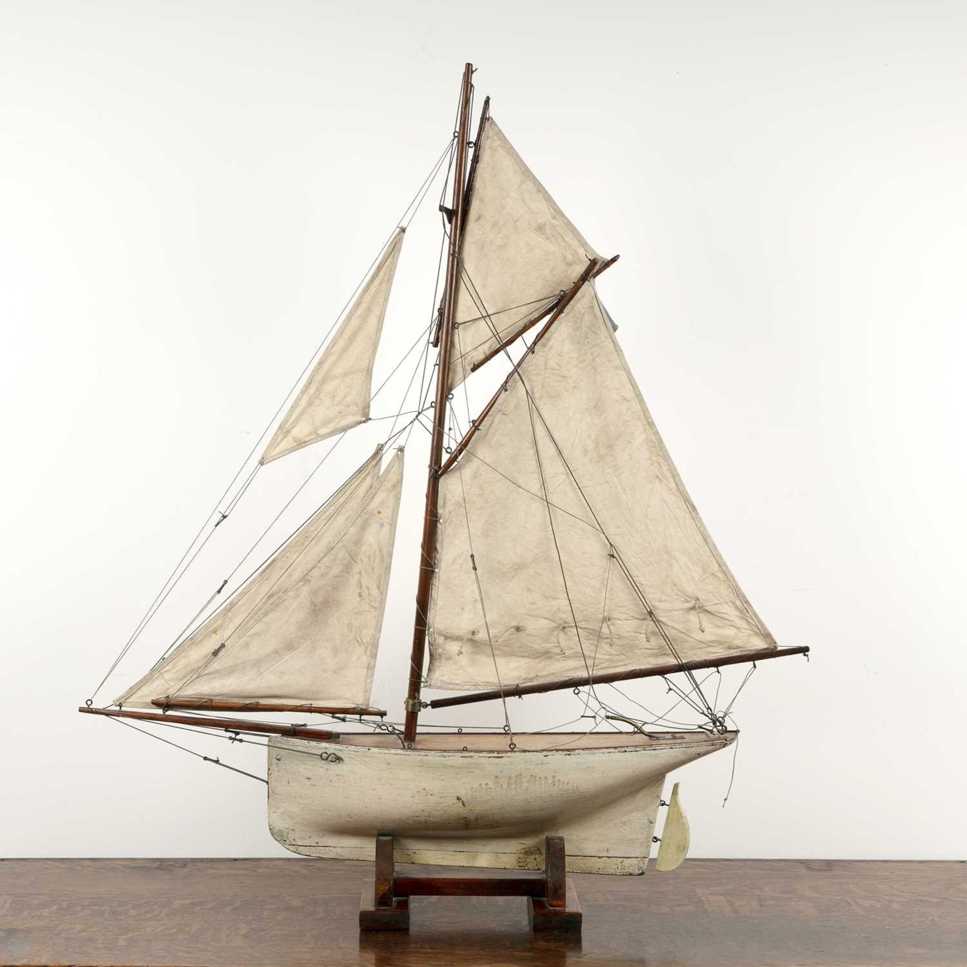Large scratch built pond yacht on stand 20th Century, painted white hull with linen sails, 98.5cm