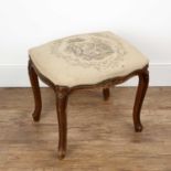Walnut framed foot stool 19th Century, with an overstuffed needlework seat decorated with a male and