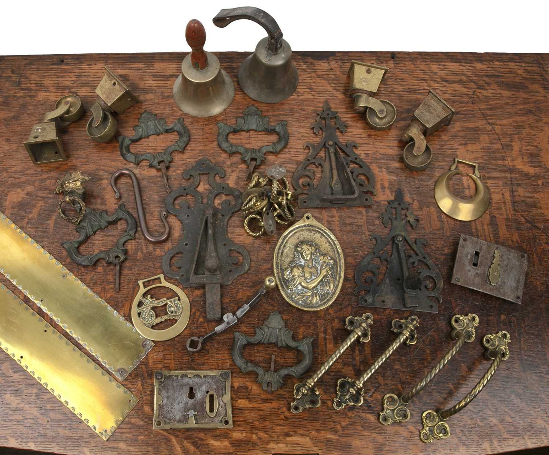 Group of metalware 19th Century and later, including brass locks, doorplates, castors, horse
