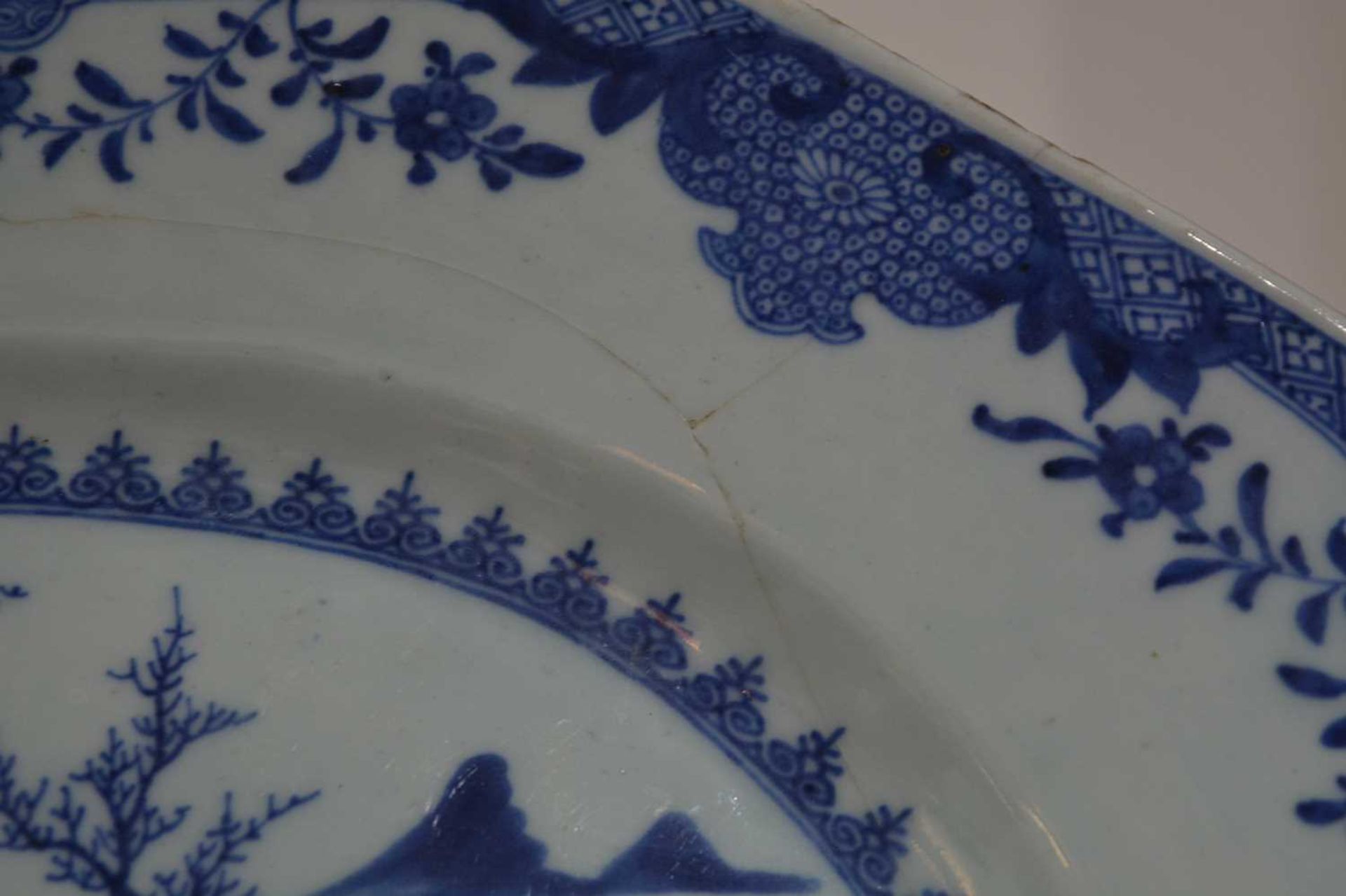 Three blue and white export dishes Chinese, circa 1800, the largest meat plate with tree and - Image 5 of 15