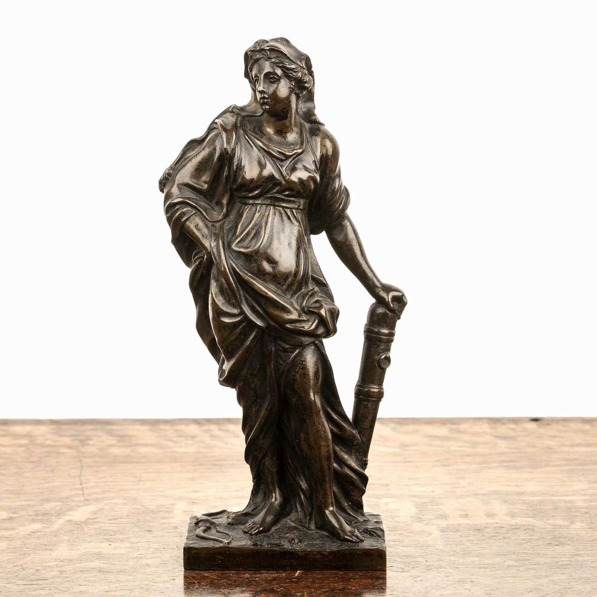 Bronze model of a maiden 19th Century, the classical figure resting her hand on a cannon and the