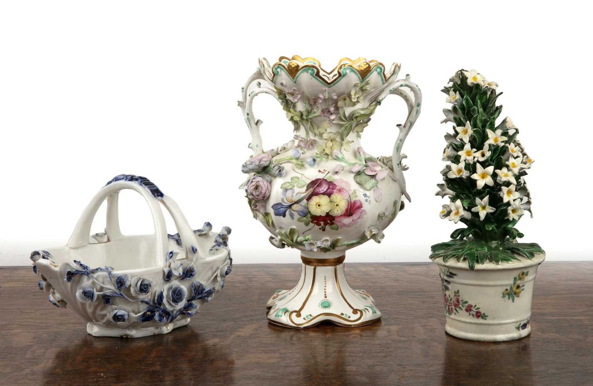 Three porcelain pieces including a Bow porcelain model vase of flowers, 19cm high, a Helena Wolfsohn