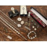 Collection of costume and silver jewellery including: silver locket, porcelain brooch in precious