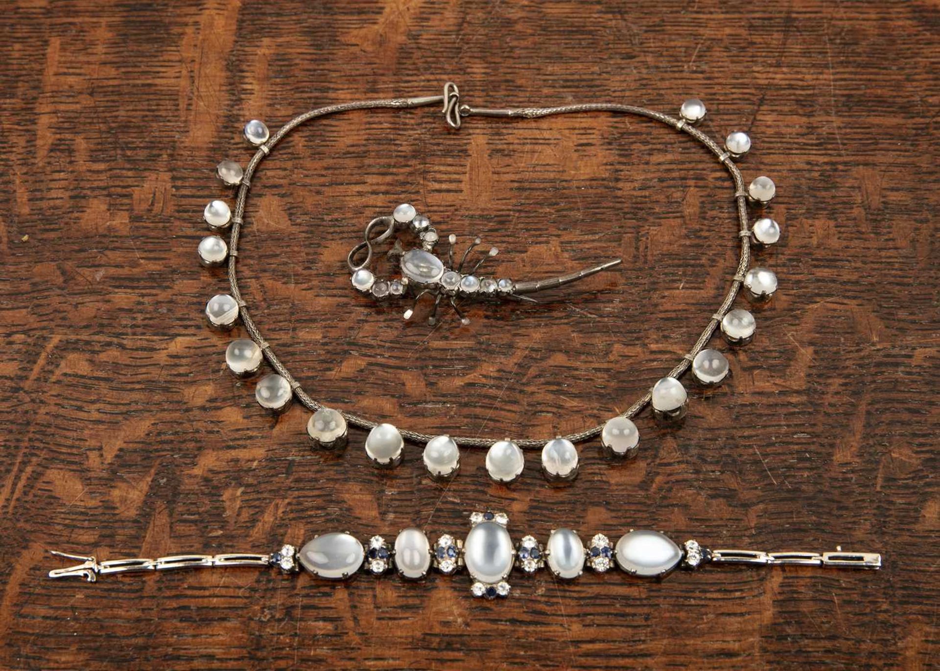 Collection of moonstone jewellery comprising of a white metal mounted necklace set with twenty one