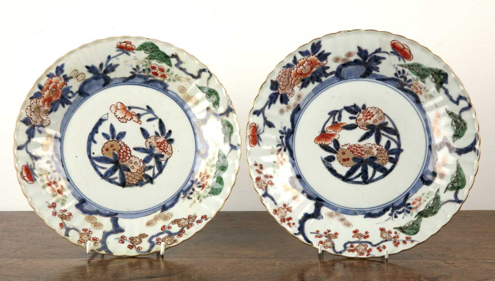 Pair of Japanese Imari patterned porcelain plates 19th Century, decorated with flowers, blossom