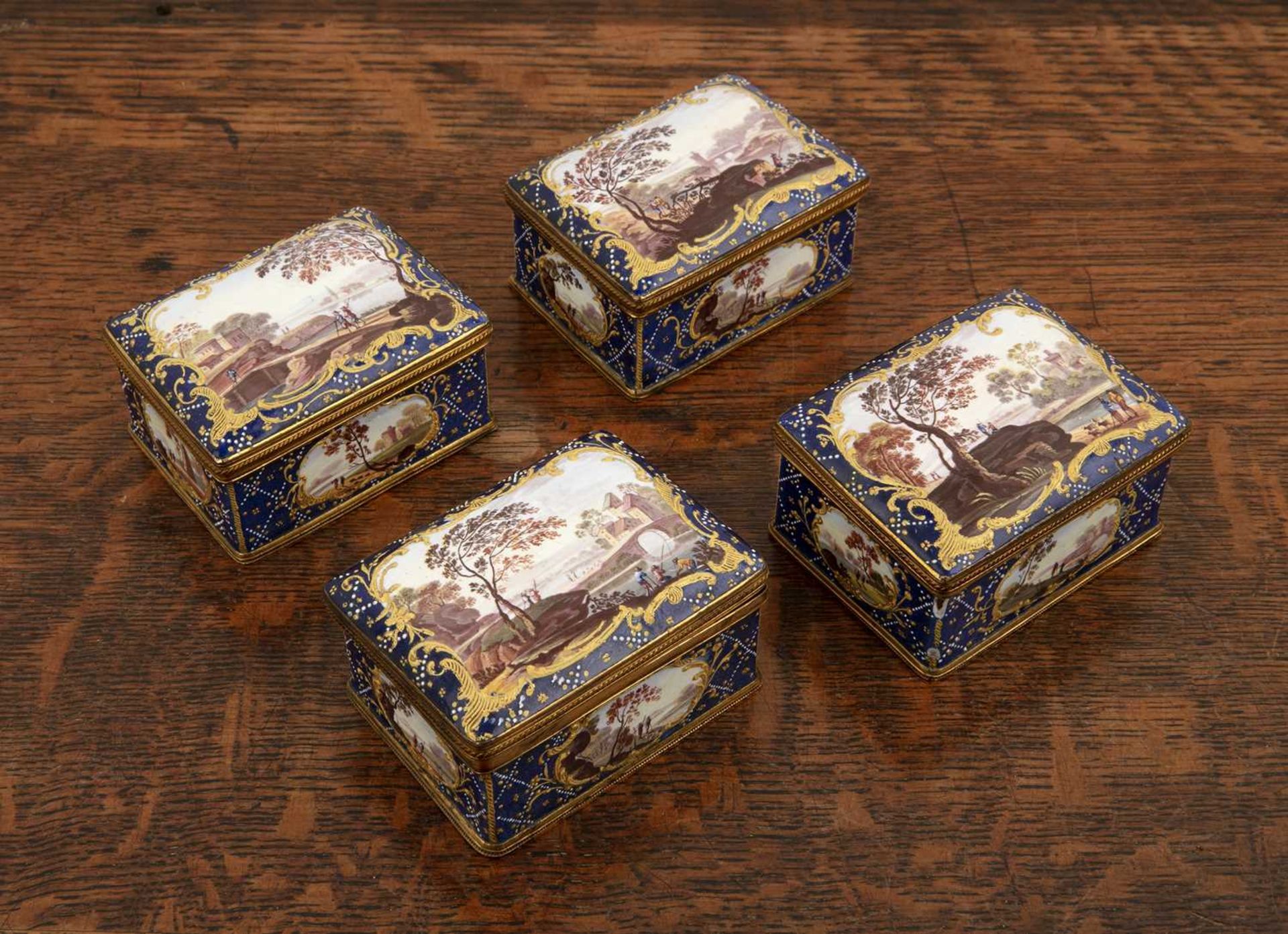 Set of four rectangular shaped enamel boxes English, 19th Century each painted with panels of