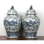 Pair of blue and white large vases and covers Chinese, 20th Century each painted with dragons and