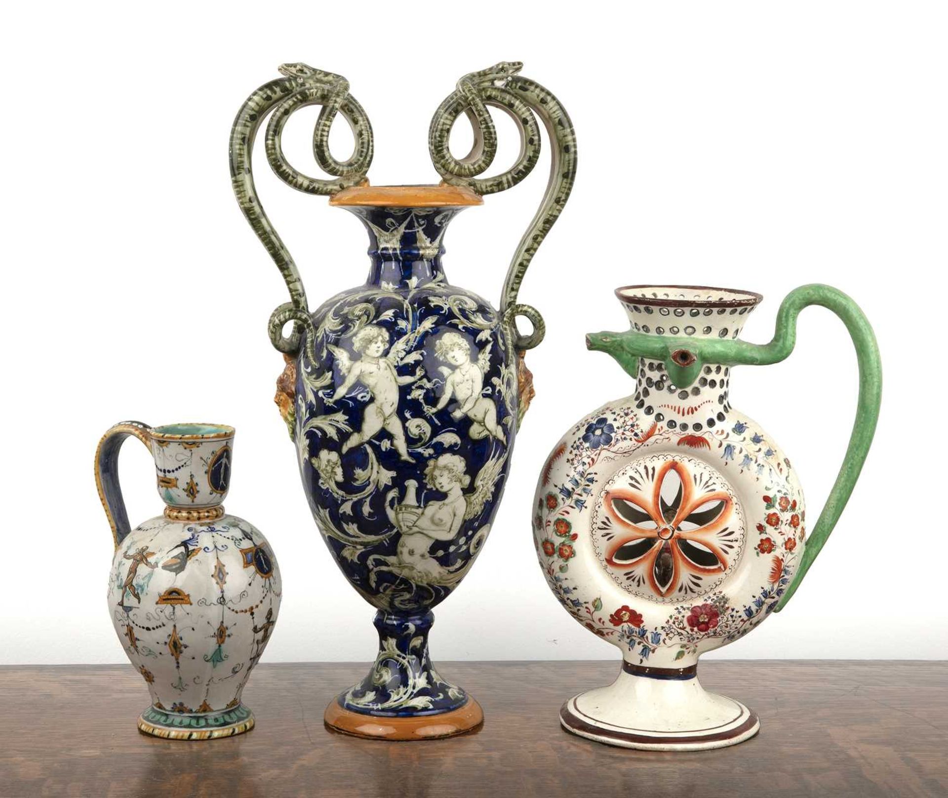 Group of creamware and majolica including an Italian cobalt blue vase with mask and serpent handles,