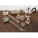 Group of pieces including a silver oval desk stand, a silver plated teapot, four inkwells, and two