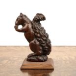 Treen model of a squirrel 19th Century, the animal crouched and about to eat a nut, on a later