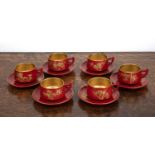 Japanese lacquer tea set 20th Century, six settings, with gilt painted blossom decoration on a red