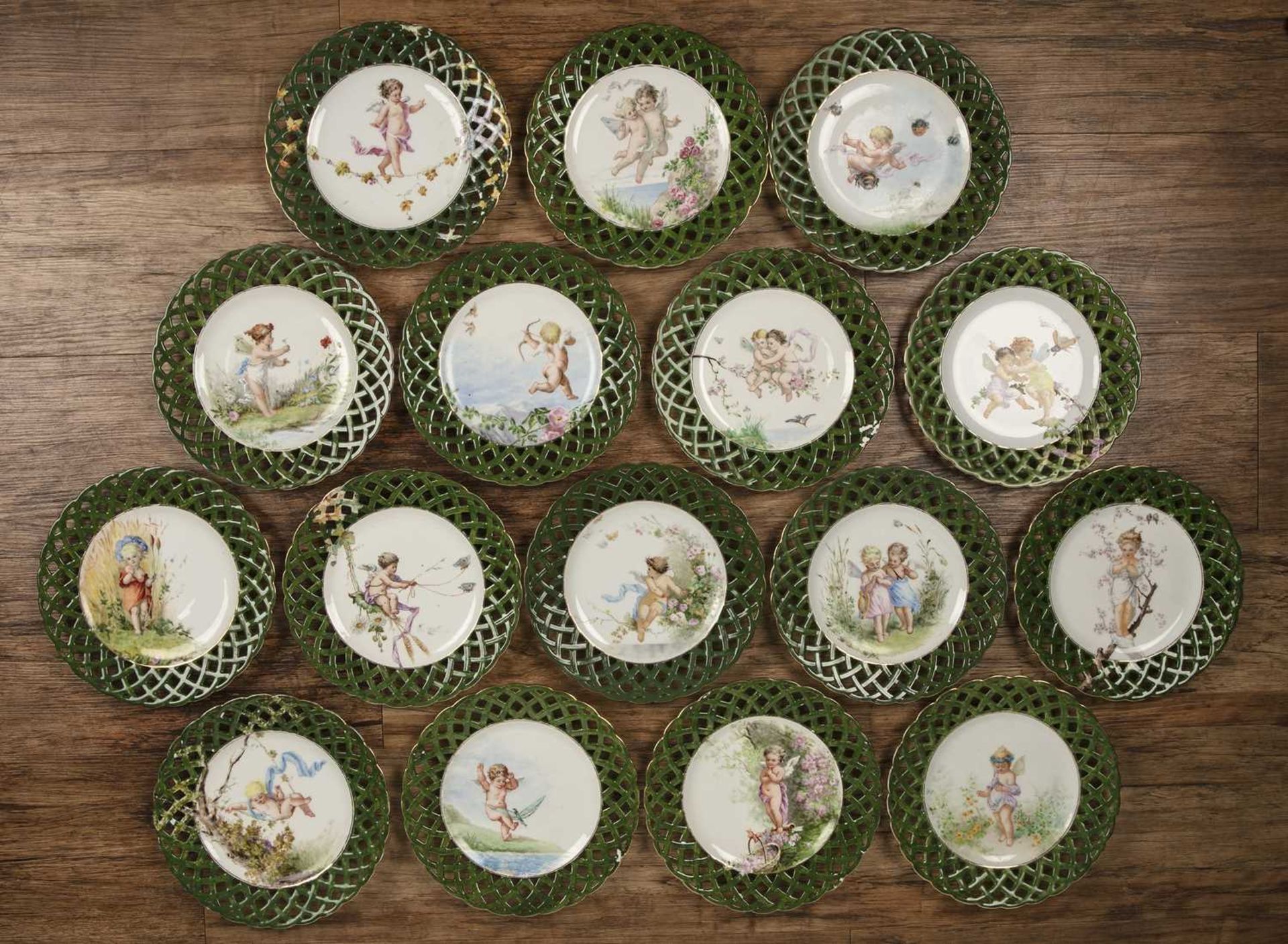 Set of sixteen Continental hand painted cabinet plates possibly Austrian, each decorated with