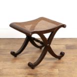 Mahogany X framed stool with a cane seat, 52cm wide x 40cm deep x 44cm high Provenance: The