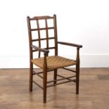 Arts and Crafts childs chair Stained beech frame, with lattice back and rush seat, unmarked, 68.