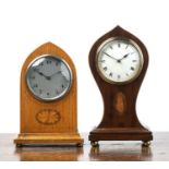 Two Edwardian inlaid mantel clocks One an oak cased lancet clock example with Arabic numberal to the