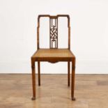 Aesthetic movement Mahogany, chair in the Japanese taste, with bergere caned seat, on scrolled pad