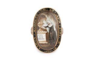 A late 18th century ivory and enamel memorial ring, the oval ivory panel painted to depict a